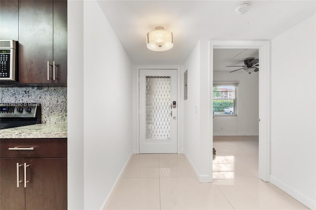12501 SW 14th St Unit 108R, Pembroke Pines, FL 33027 - doorway to outside with light tile patterned floors, baseboards, and ceiling fan