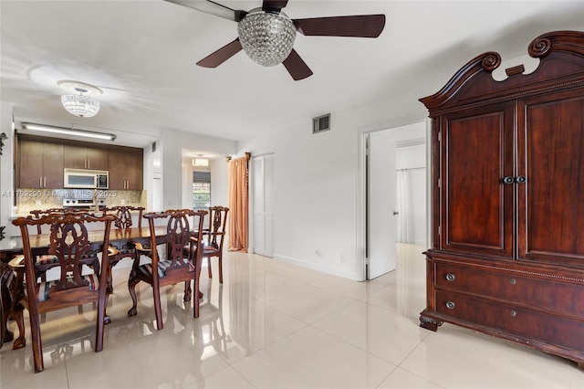 12501 SW 14th St Unit 108R, Pembroke Pines, FL 33027 - dining room with a ceiling fan, light tile patterned flooring, and baseboards