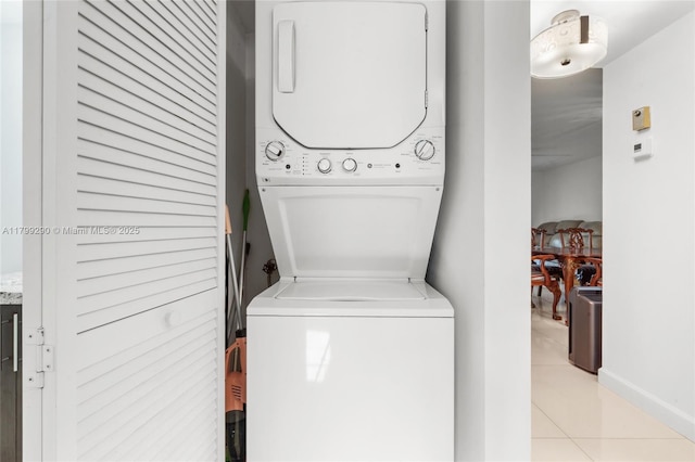 12501 SW 14th St Unit 108R, Pembroke Pines, FL 33027 - laundry area featuring stacked washer and clothes dryer and light tile patterned flooring