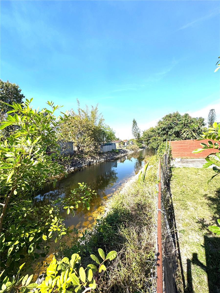 water view featuring fence