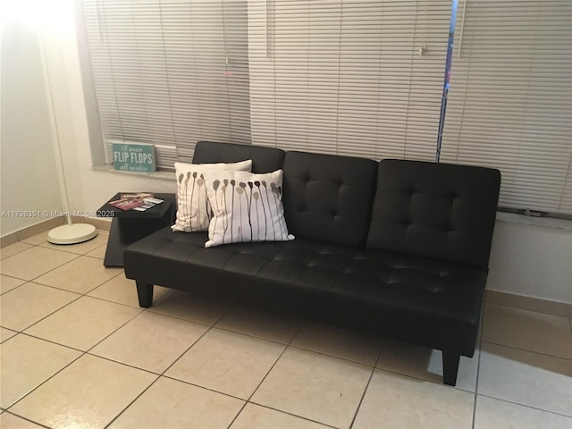 sitting room with tile patterned floors and baseboards