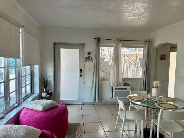 7435 Harding Ave Unit 101, Miami Beach, FL 33141 - dining space with healthy amount of natural light, a textured ceiling, ornamental molding, cooling unit, and light tile patterned floors