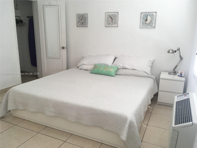 bedroom featuring light tile patterned floors