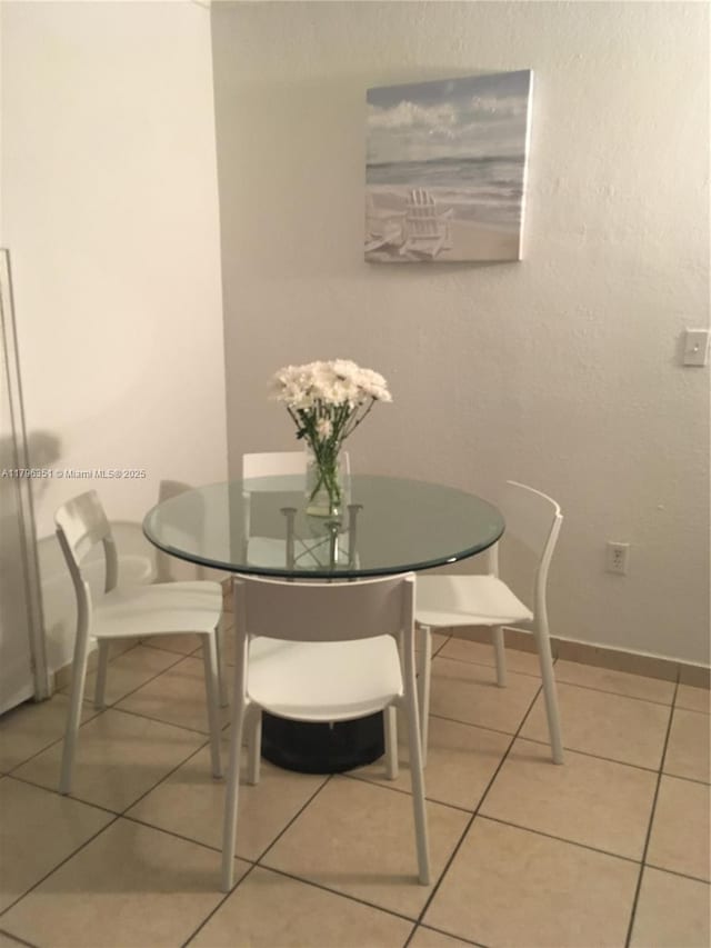 dining room with light tile patterned floors