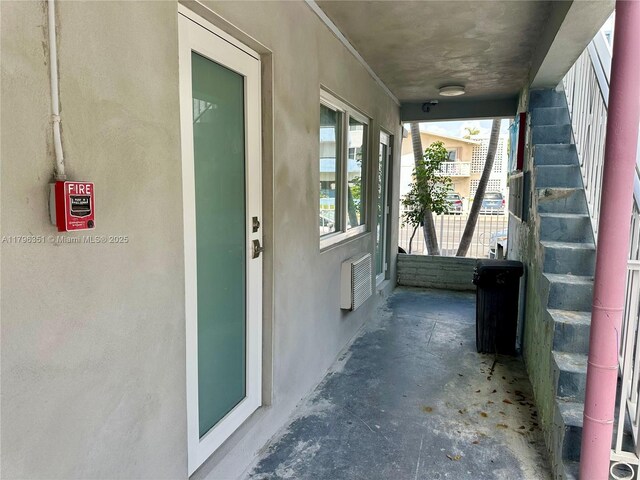 7435 Harding Ave Unit 101, Miami Beach, FL 33141 - doorway to property featuring stucco siding