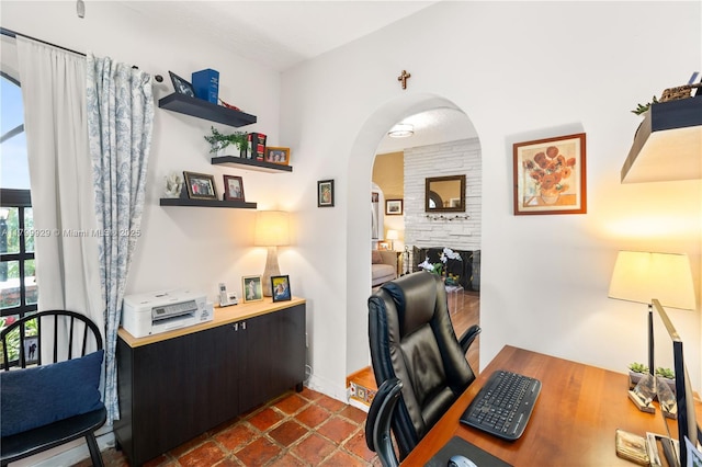 425 Cadagua Ave, Coral Gables, FL 33146 - office space with arched walkways and a stone fireplace