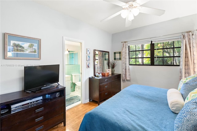 425 Cadagua Ave, Coral Gables, FL 33146 - bedroom with light wood finished floors, ensuite bathroom, and ceiling fan