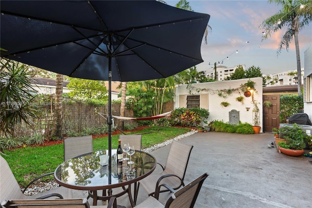 425 Cadagua Ave, Coral Gables, FL 33146 - view of patio with outdoor dining space and fence