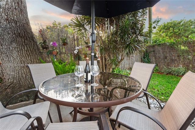 425 Cadagua Ave, Coral Gables, FL 33146 - view of patio featuring outdoor dining space and fence