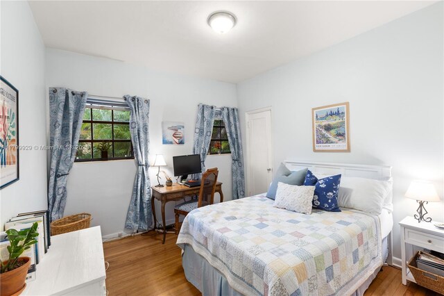 425 Cadagua Ave, Coral Gables, FL 33146 - bedroom featuring wood finished floors and baseboards