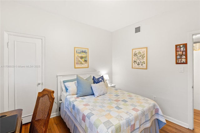 425 Cadagua Ave, Coral Gables, FL 33146 - bedroom with wood finished floors and baseboards