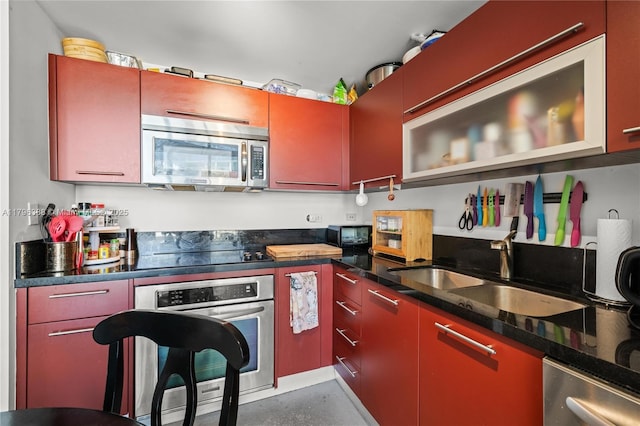 244 Biscayne Blvd Unit 645, Miami, FL 33132 - kitchen with stainless steel appliances, red cabinets, and a sink