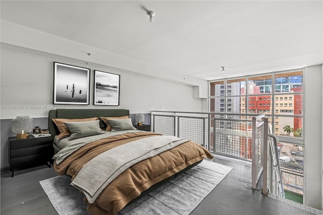 244 Biscayne Blvd Unit 645, Miami, FL 33132 - bedroom featuring concrete floors and a wall of windows
