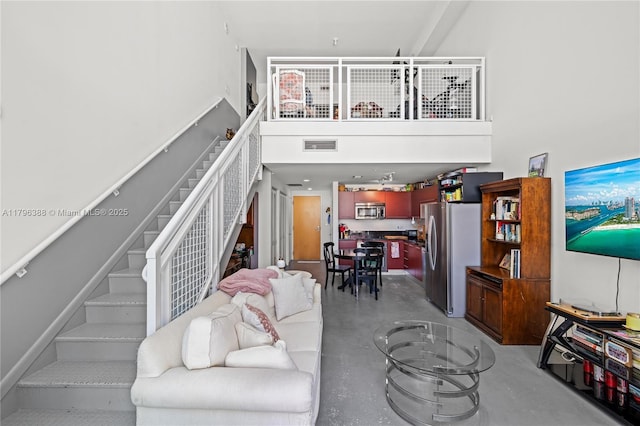 244 Biscayne Blvd Unit 645, Miami, FL 33132 - living area with concrete floors, stairs, and a high ceiling