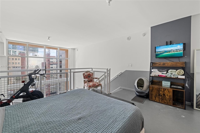 244 Biscayne Blvd Unit 645, Miami, FL 33132 - bedroom featuring finished concrete flooring, expansive windows, and baseboards