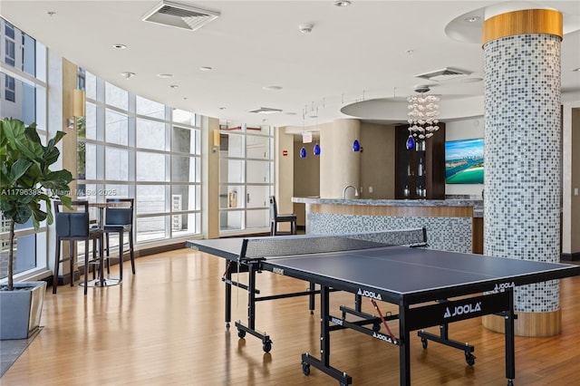 244 Biscayne Blvd Unit 645, Miami, FL 33132 - rec room featuring wood finished floors, plenty of natural light, recessed lighting, and a wall of windows