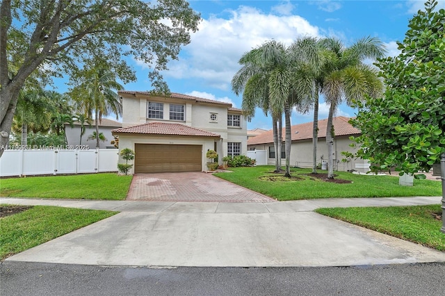 3372 SW 179th Ave, Miramar, FL 33029 - mediterranean / spanish house with decorative driveway, stucco siding, a tiled roof, and a gate