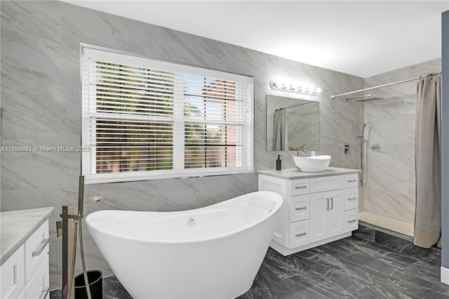 3372 SW 179th Ave, Miramar, FL 33029 - bathroom with tile walls, vanity, curtained shower, marble finish floors, and a soaking tub