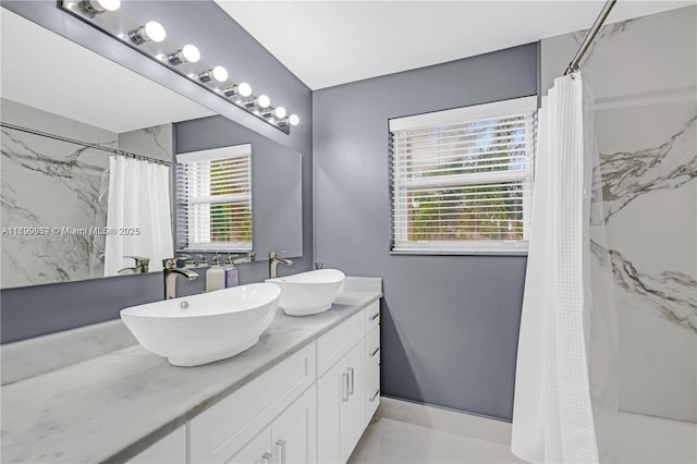 3372 SW 179th Ave, Miramar, FL 33029 - bathroom with a shower with curtain and double vanity