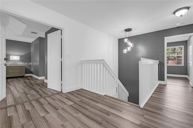 3372 SW 179th Ave, Miramar, FL 33029 - hall featuring an upstairs landing, wood finished floors, and baseboards