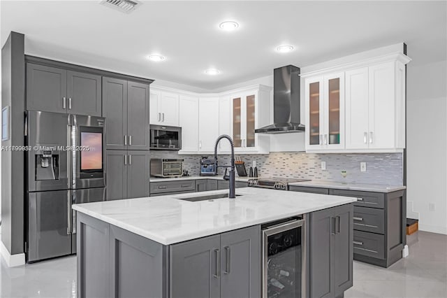 3372 SW 179th Ave, Miramar, FL 33029 - kitchen featuring appliances with stainless steel finishes, wall chimney exhaust hood, wine cooler, gray cabinets, and recessed lighting