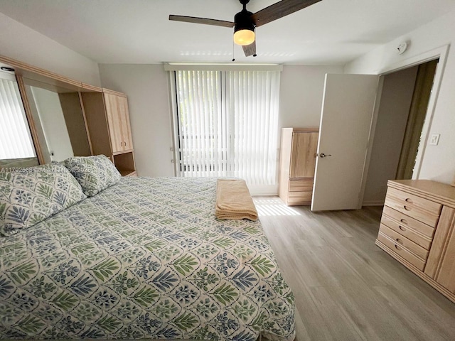 7950 W Mcnab Rd Unit 222, Tamarac, FL 33321 - bedroom with light wood-style flooring and ceiling fan