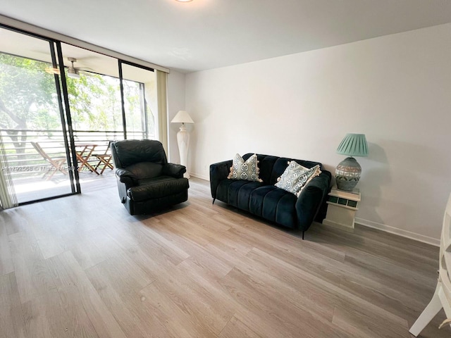 7950 W Mcnab Rd Unit 222, Tamarac, FL 33321 - living area featuring wood finished floors, baseboards, and expansive windows