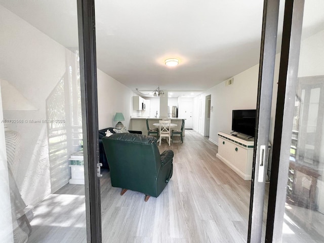 7950 W Mcnab Rd Unit 222, Tamarac, FL 33321 - living room featuring light wood-type flooring