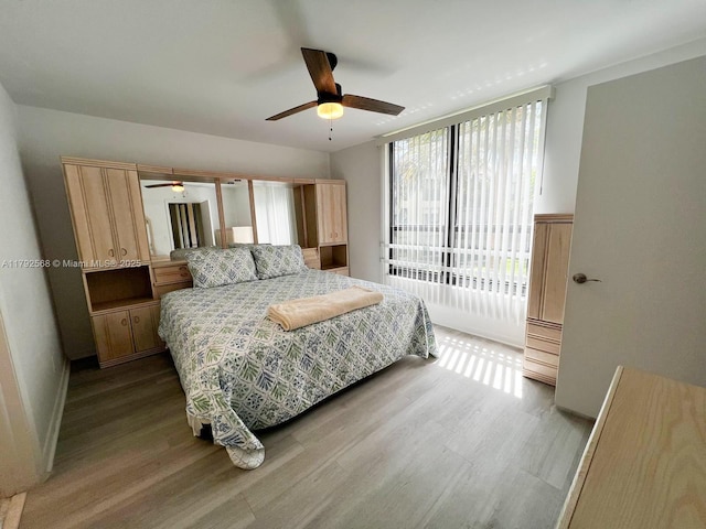 7950 W Mcnab Rd Unit 222, Tamarac, FL 33321 - bedroom with wood finished floors, access to outside, a ceiling fan, and baseboards