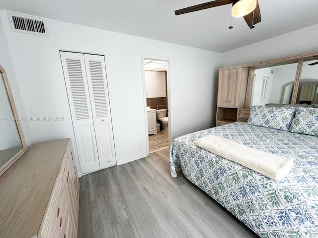 7950 W Mcnab Rd Unit 222, Tamarac, FL 33321 - bedroom featuring light wood finished floors, a closet, ensuite bathroom, and ceiling fan