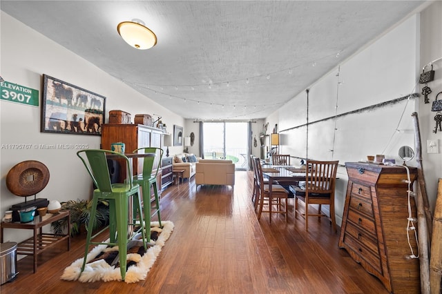 1470 NE 125th Ter Unit Ph9, North Miami, FL 33161 - dining room featuring hardwood / wood-style flooring and a textured ceiling