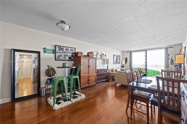1470 NE 125th Ter Unit Ph9, North Miami, FL 33161 - dining space with dark wood finished floors