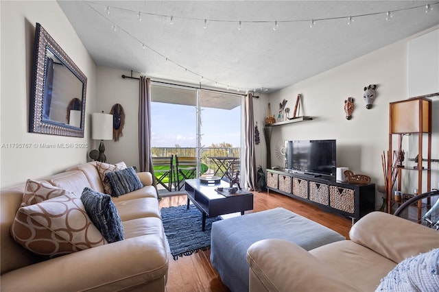 1470 NE 125th Ter Unit Ph9, North Miami, FL 33161 - living area featuring wood finished floors and floor to ceiling windows