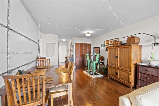 1470 NE 125th Ter Unit Ph9, North Miami, FL 33161 - dining room featuring dark wood-type flooring