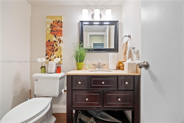 1470 NE 125th Ter Unit Ph9, North Miami, FL 33161 - bathroom with vanity, toilet, wood finished floors, and baseboards
