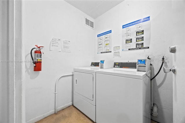 1470 NE 125th Ter Unit Ph9, North Miami, FL 33161 - communal laundry room featuring independent washer and dryer