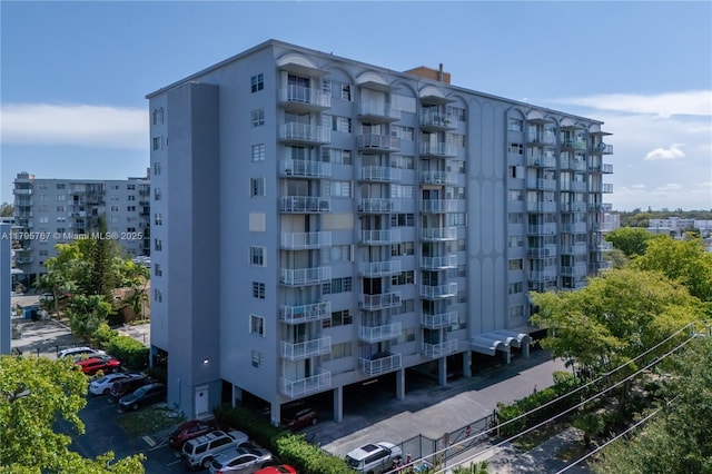 1470 NE 125th Ter Unit Ph9, North Miami, FL 33161 - view of apartment building / complex featuring uncovered parking