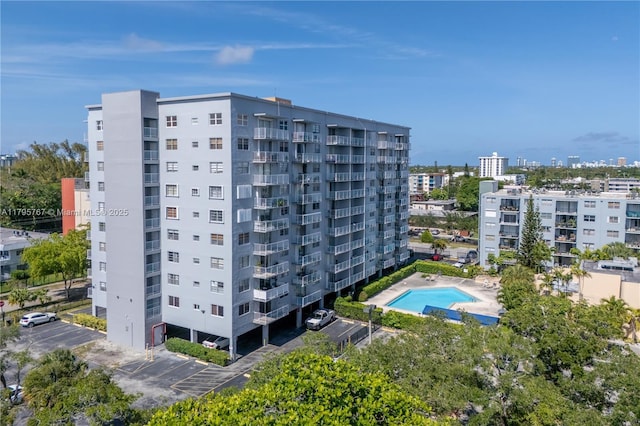 1470 NE 125th Ter Unit Ph9, North Miami, FL 33161 - view of apartment building / complex featuring uncovered parking