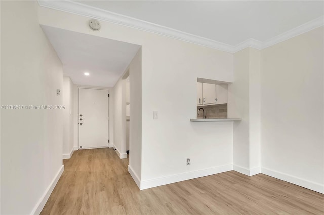 8000 SW 81st Dr Unit 103, Miami, FL 33143 - hall featuring baseboards, light wood-type flooring, crown molding, and a sink