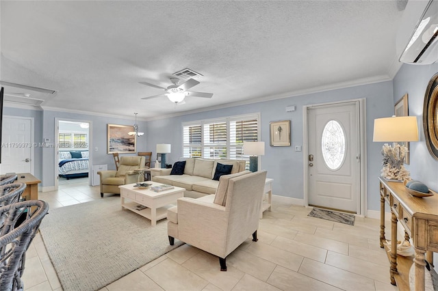 121 Tacoma Ln, Palm Beach Shores, FL 33404 - living area with plenty of natural light, a ceiling fan, ornamental molding, light tile patterned floors, and a textured ceiling
