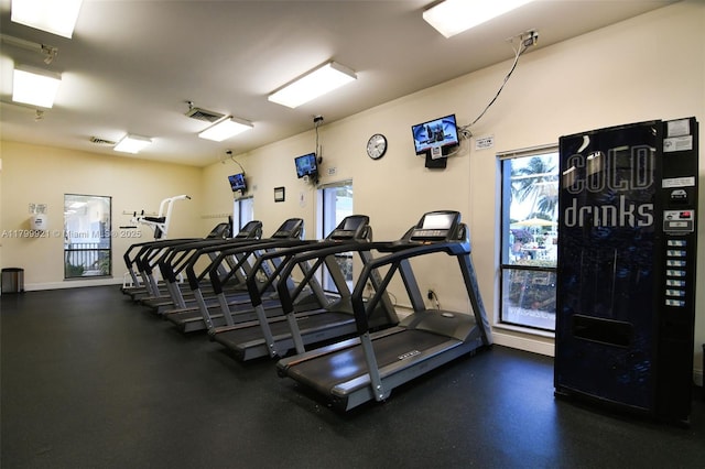 2405 Antigua Cir Unit E1, Coconut Creek, FL 33066 - exercise room featuring healthy amount of natural light and baseboards