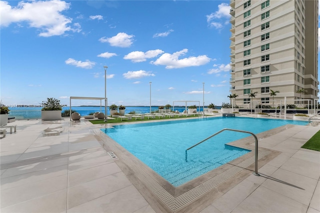 community pool with a patio area
