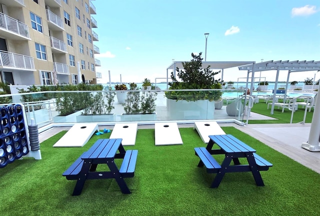 view of property's community with a lawn