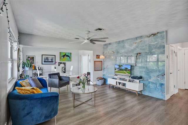 1155 Hayes St, Hollywood, FL 33019 - living room with healthy amount of natural light, wood finished floors, and ceiling fan