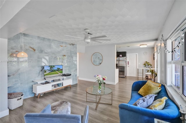 1155 Hayes St, Hollywood, FL 33019 - living area with baseboards, plenty of natural light, wood finished floors, and a ceiling fan