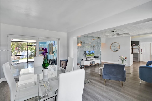 1155 Hayes St, Hollywood, FL 33019 - dining room featuring baseboards, wood finished floors, and ceiling fan