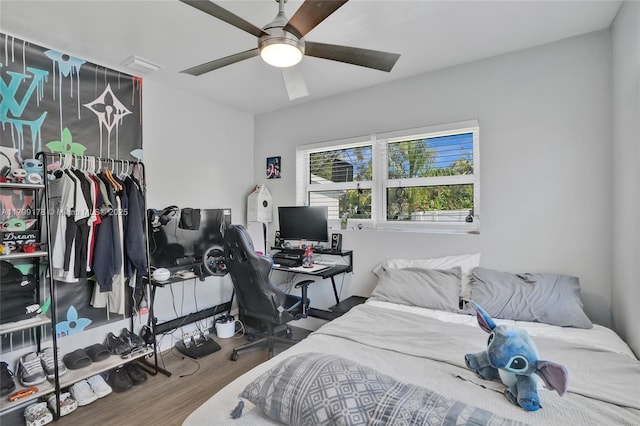 1155 Hayes St, Hollywood, FL 33019 - bedroom with wood finished floors, a desk, a closet, and ceiling fan
