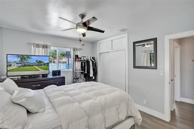 1155 Hayes St, Hollywood, FL 33019 - bedroom with wood finished floors, a closet, baseboards, and ceiling fan