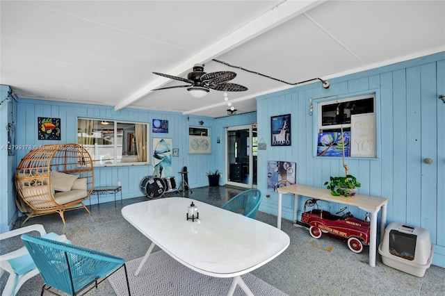 1155 Hayes St, Hollywood, FL 33019 - interior space with speckled floor, beam ceiling, ceiling fan, and wood walls