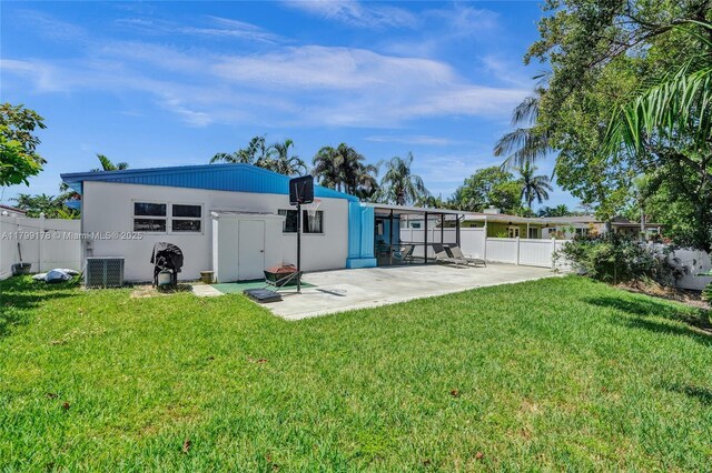 1155 Hayes St, Hollywood, FL 33019 - rear view of property featuring a patio and central AC unit